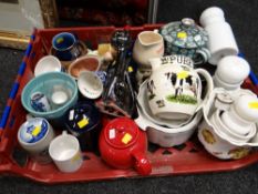 A crate of various china including teapots, jugs, planters etc
