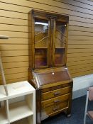 A vintage oak bureau bookcase