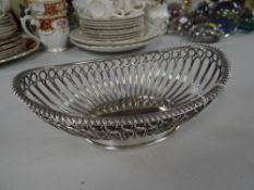 A WMF silver-plate basket in oval open work form
