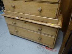 A low two-drawer pine chest