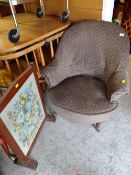 A vintage tub-style bedroom chair together with a tapestry fire screen