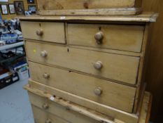 A low pine chest of drawers, two short above two long