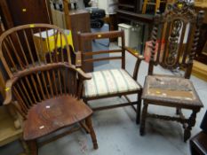 A stripped back elm seated Windsor-style armchair together with an ornately carved high backed