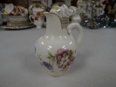 A Royal Worcester floral decorated jug