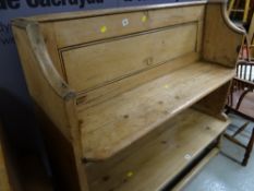 A stripped pine short church pew, height - 85cms, length - 127cms, depth - 32cms