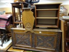 A nicely carved oak coffer, magazine racks, nest of tables etc
