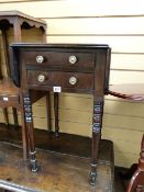An antique mahogany small drop leaf two-drawer table
