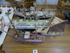 Four titled model boats on stands including one of 'Titanic 1912'