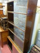 Five section bookcase cupboard with glazed sliding doors