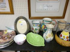 Quantity of decorative wall plates and a selection of colourful vases etc