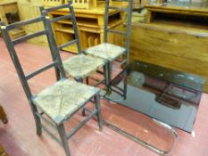 Three vintage rush seated bedroom chairs and a modern chrome framed glass topped coffee table (still
