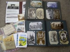 Three albums of vintage postcards and other ephemera