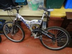 Silver framed multi gear mountain bike with mono suspension