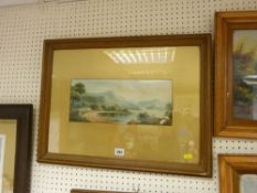 Unsigned watercolour - lakeside bay with rolling mountains and buildings to the foreground, dated