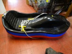 Parcel of four plastic children's snow sledges