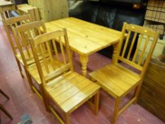 Pine dining table with four chairs