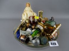 Glass dish containing a quantity of miniature collectables