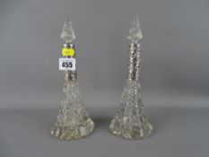 Pair of silver mounted conical scent bottles with stoppers