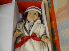 Child's deckchair and a boxed doll with certificate
