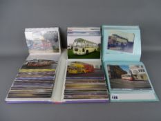 Two albums containing photographs of vintage buses and coaches