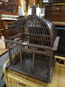 An ornamental hanging bird cage