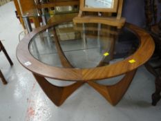 A circular glass top G-Plan style coffee table, 45cms high