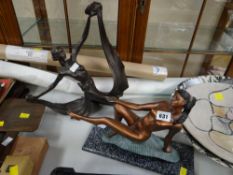 Two Art Deco-style figures