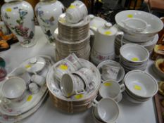 A large parcel of JL Menau German floral decorated dinnerware