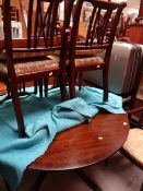 A reproduction mahogany circular extending dining table together with a set of six (2+4) matching