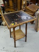 A bamboo painted occasional table with lower shelf