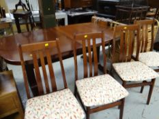 A Danish Farstrup dark wood extending dining table & stained beech wood with ten chairs (2+8), 74