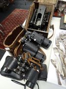 Four pairs of binoculars together with a vintage cased bubble sextant