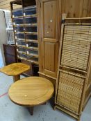 A lightwood Deco-style octagonal table together with a modern circular coffee table & bamboo screen