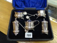 A cased hallmarked silver five-piece condiment set