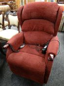 A burgundy upholstered electric recliner E/T