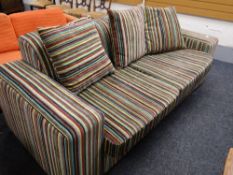 A modern striped fabric sofa bed