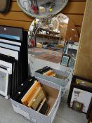 A large arch-top hall mirror together with a box of various frames