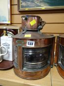 A polished copper mast head light converted to electricity E/T