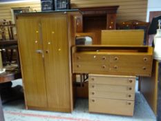 A vintage Schreiber bedroom suite comprising two-door wardrobe, chest of drawers, mirrored