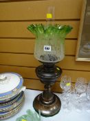 A green glass oil lamp