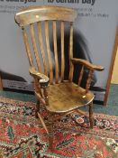 An antique elm seated country-style farmhouse kitchen chair