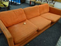 A retro 1970s large G-Plan three-seater sofa with rosewood panelling to side & back (distressed)