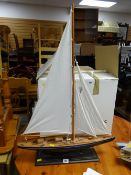 Single mast pond yacht on stand