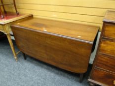 An antique mahogany drop leaf dining table, 72 x 121 x 151cms