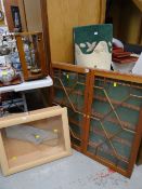 A vintage pine two-door glazed hanging wall display cabinet together with a modern wall hanging
