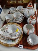 A Japanese Satsuma decorated eggshell export teaset