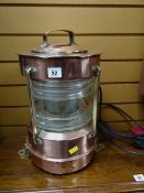 A polished copper & brass ship's mast head lamp converted to electricity E/T