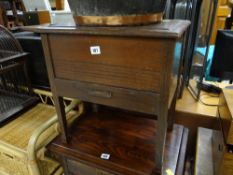 A vintage sewing box on raised feet together with contents