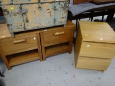 A pair of modern hardwood single drawer bedside cabinets together with an IKEA two-drawer cabinet