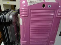 Two rigid pull-along suitcases